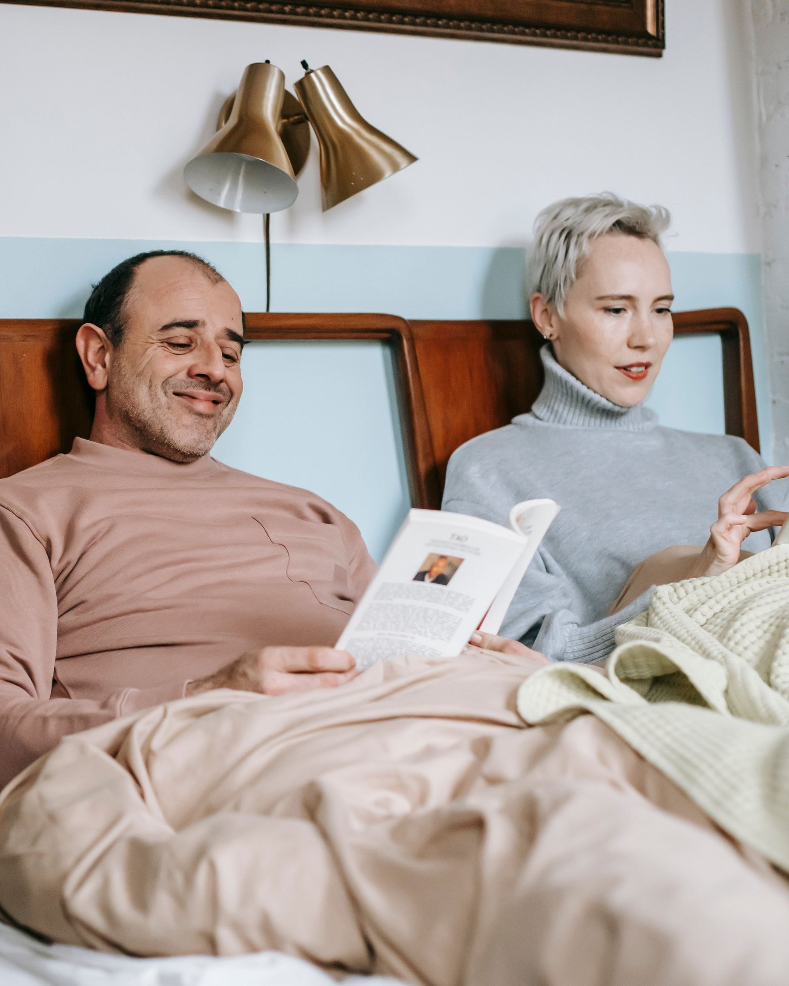A couple reading together in bed