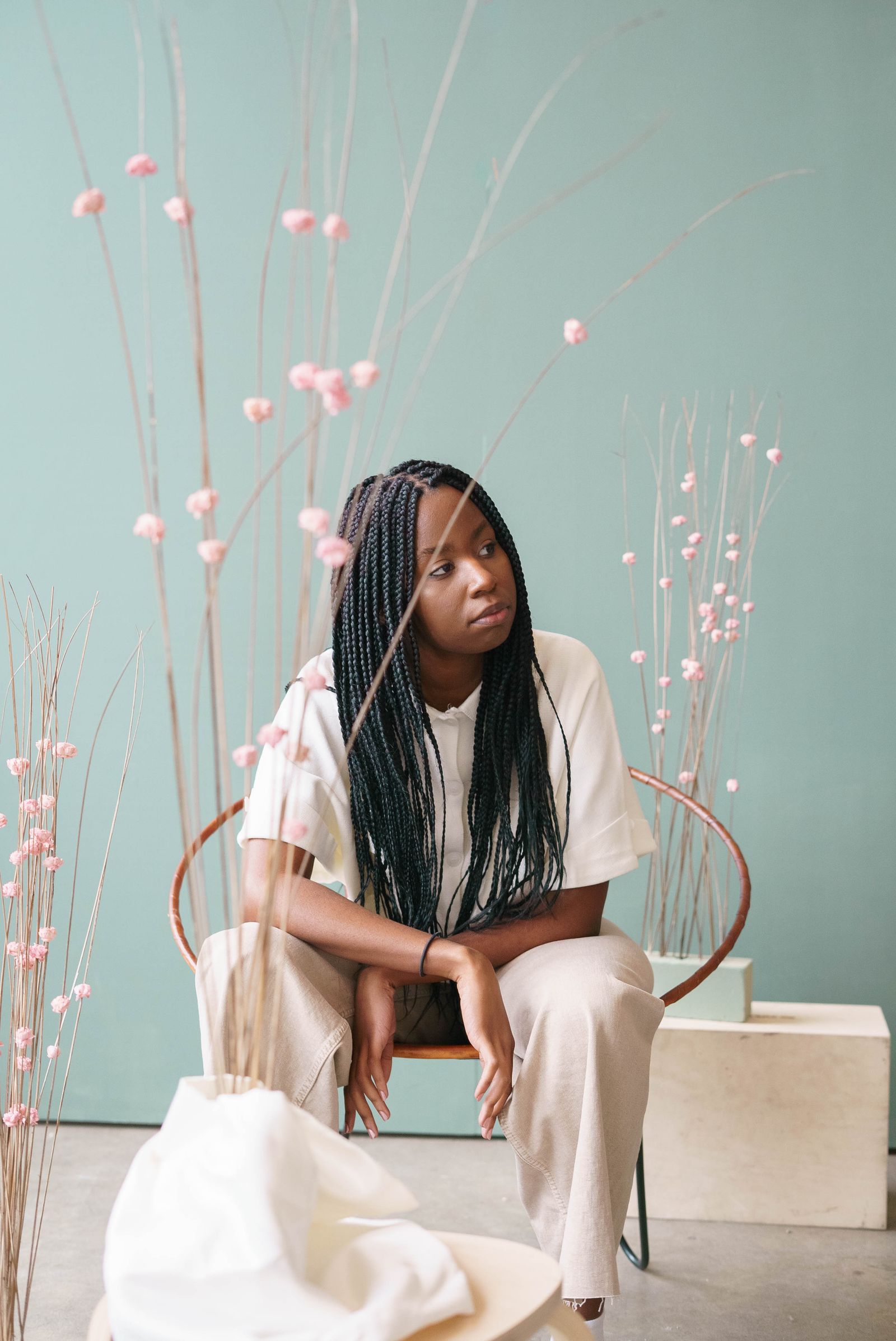 A young woman sitting quietly and looking aside